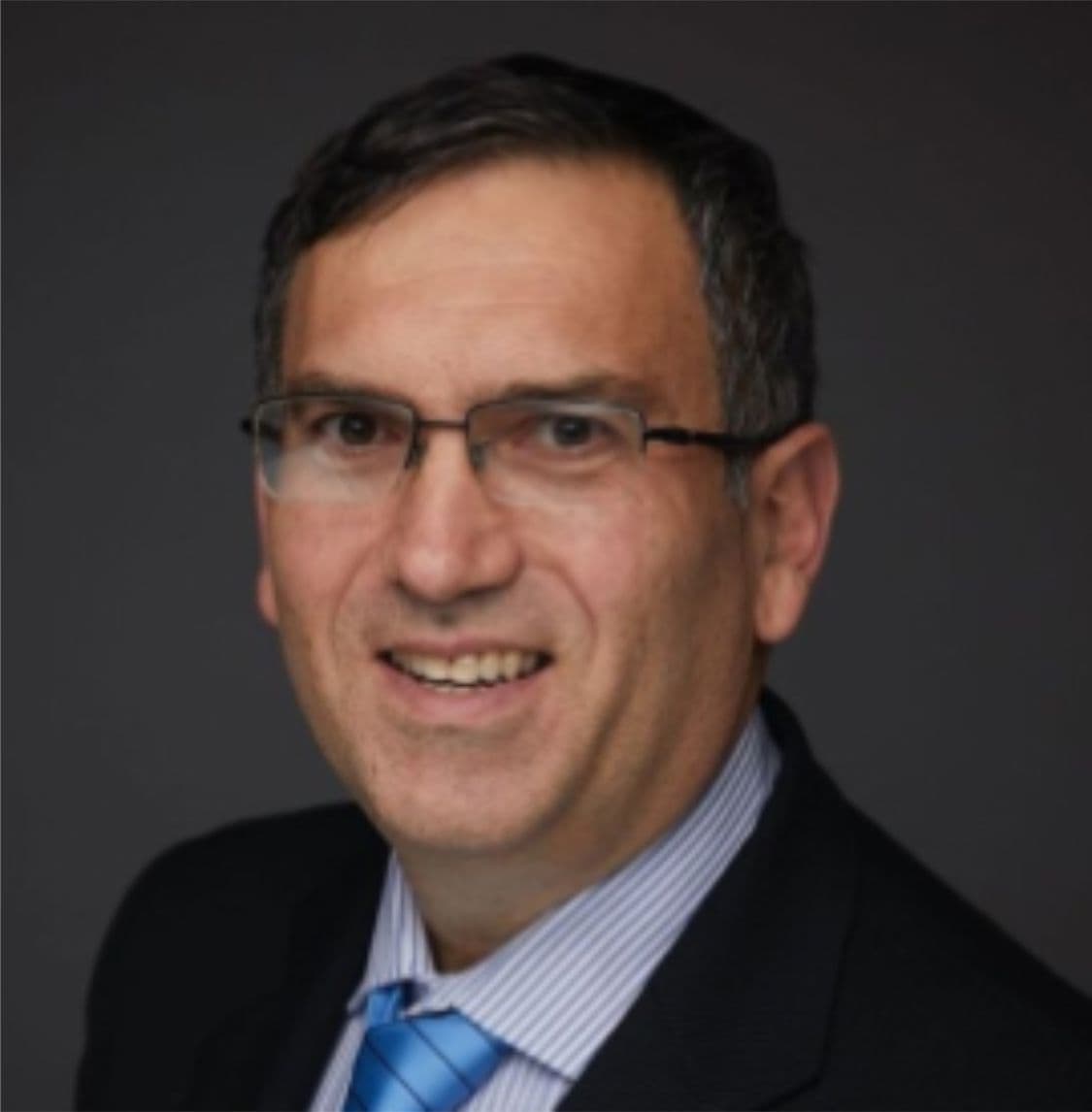 Alexander Krakovsky in glasses, suit and tie photo